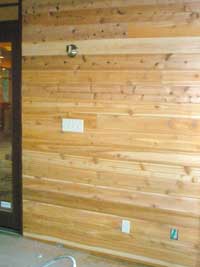 Ship-lap cedar paneling on the wall of the 'bug room'